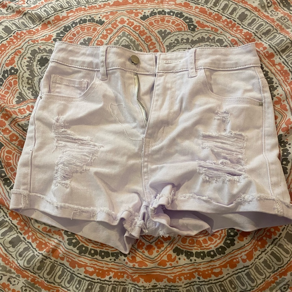 White jean shorts with rips